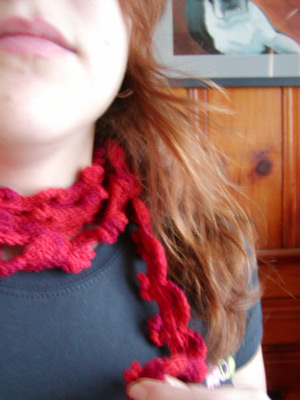 ultramerino4-red-curl1.jpg http://midnightknitter.com/blog/wp-content/uploads/2006/12/ultramerino4-red-curl1.jpg