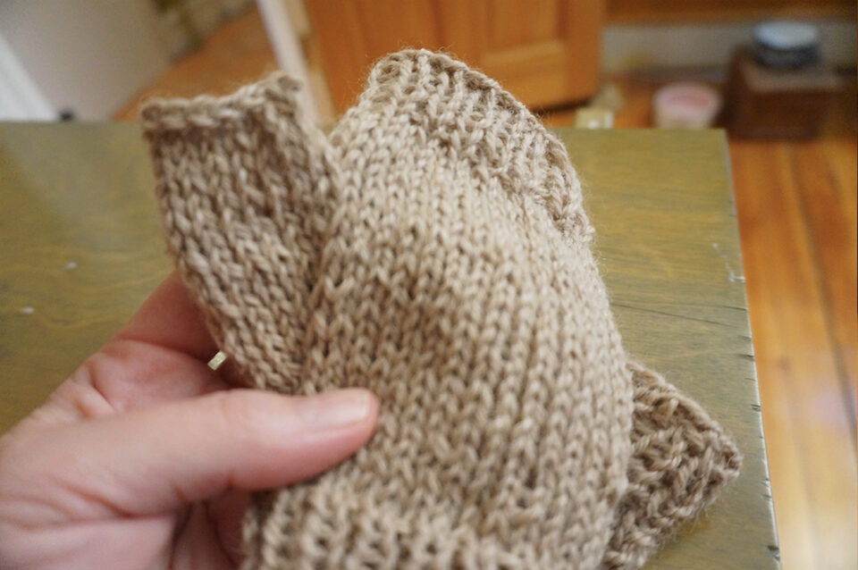 closeup of knitted thumb